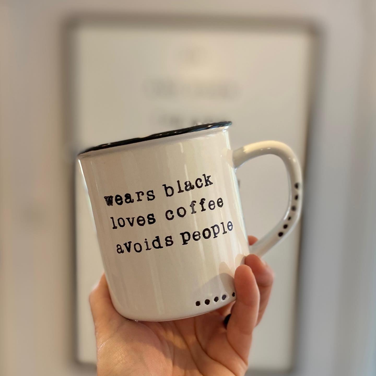 Wears black loves coffee avoids people